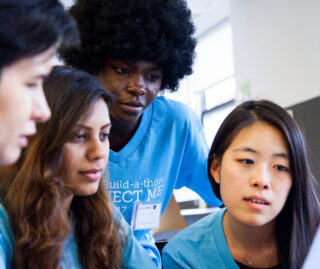Students looking at computer
