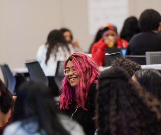For Students - Student with Pink Hair Smiling